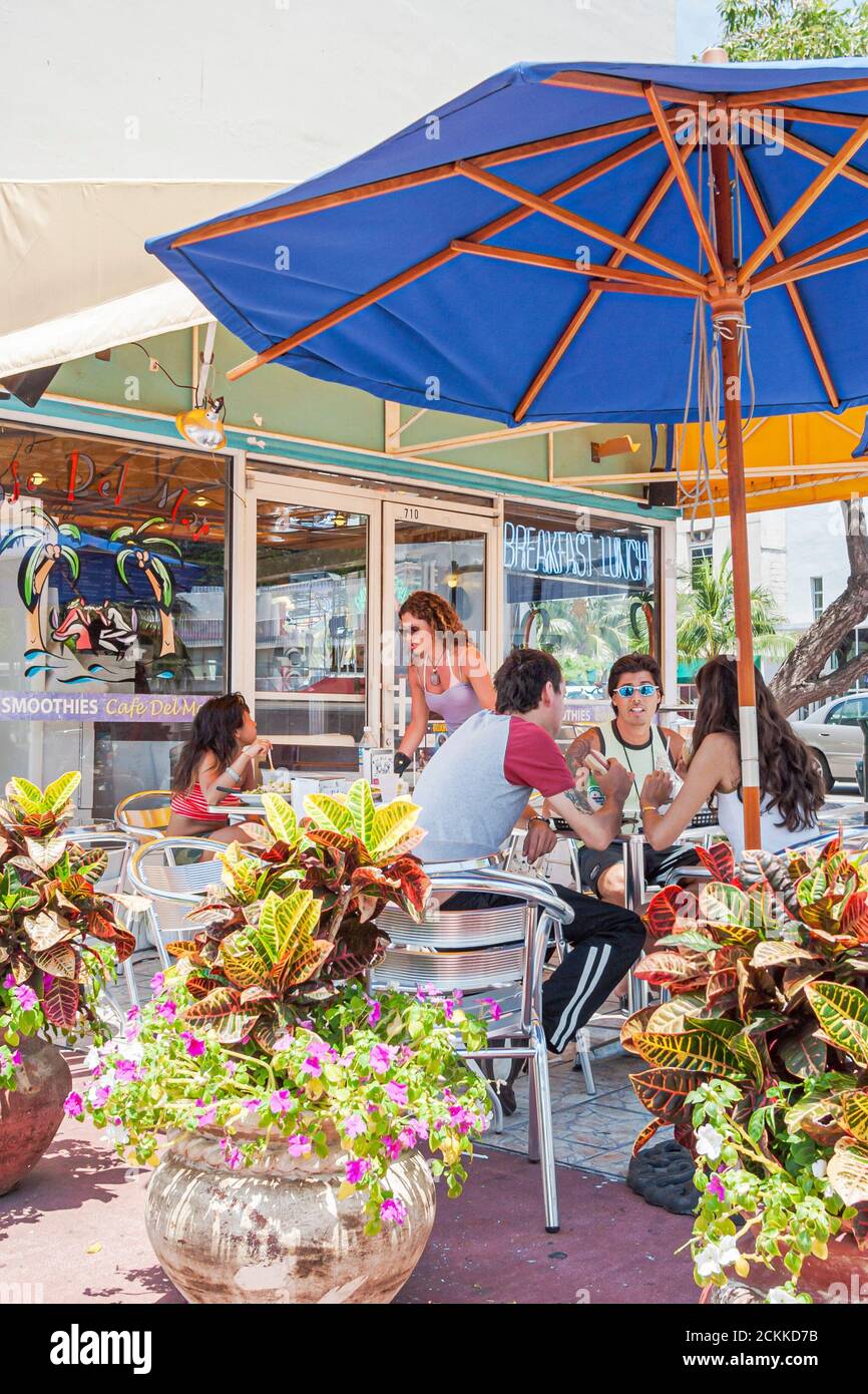 Miami Beach Florida,al fresco sidewalk outside outdoors tables restaurant restaurants dining,Café del Mar eating out,food,visitors group people person Stock Photo