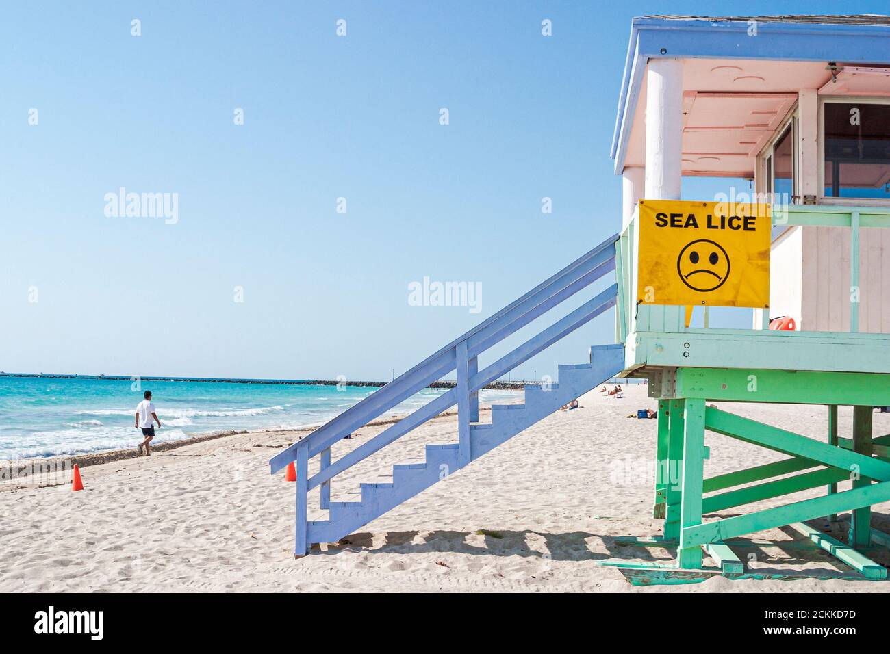 Miami Beach Florida,Atlantic Oceqn Shore shoreline coast seashore,lifeguard station hut tower on public beaches,sand sign sea lice warning banner Stock Photo