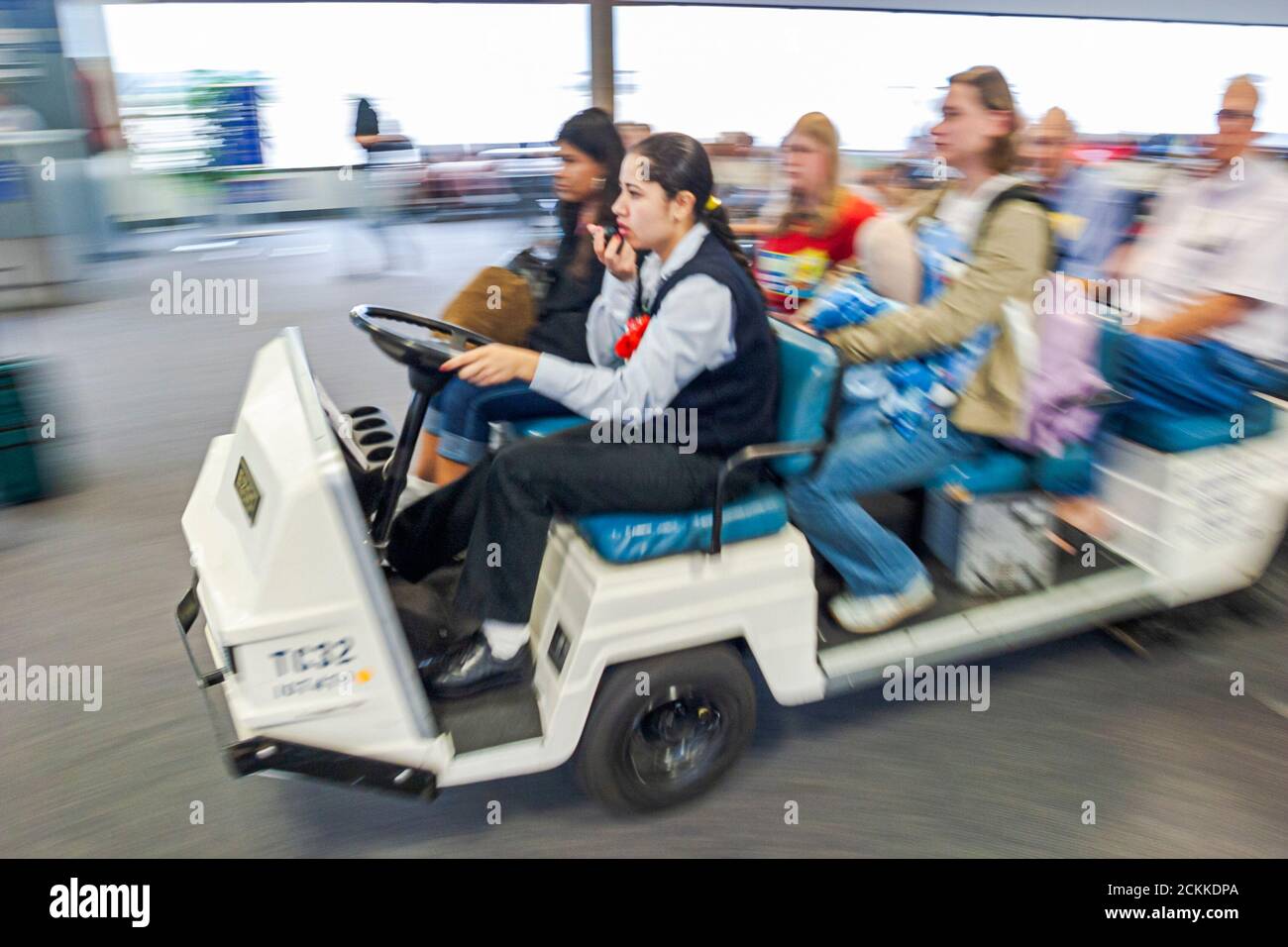 Houston Texas,George Bush Intercontinental Airport,terminal gate area,electric cart carrying physically challenged airline passengers to flights Stock Photo
