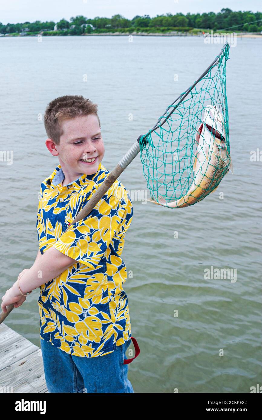 Child fish net hi-res stock photography and images - Alamy