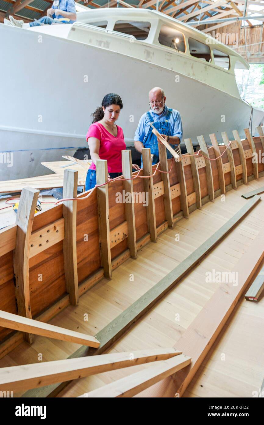 Virginia Newport News Mariners' Museum,history exhibit,handcrafted hand crafted ship boat builder building man men showing woman female how working Stock Photo