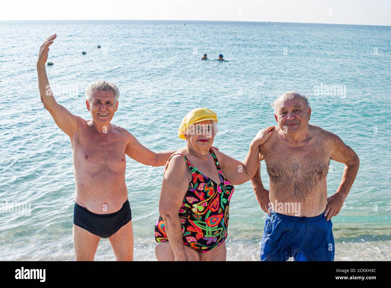 Miami Beach Florida,Eastern European Jewish immigrant immigrants sunbather sunbathers,sand surf overweight obese obesity fat senior seniors man men wo Stock Photo