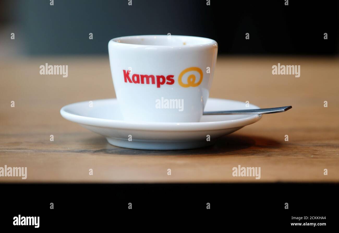 The logo of Germany's largest bakery chain Kamps is pictured on an espresso cup at a Kamps bakery shop in Dusseldorf, Germany, August 9, 2019.   REUTERS/Wolfgang Rattay Stock Photo