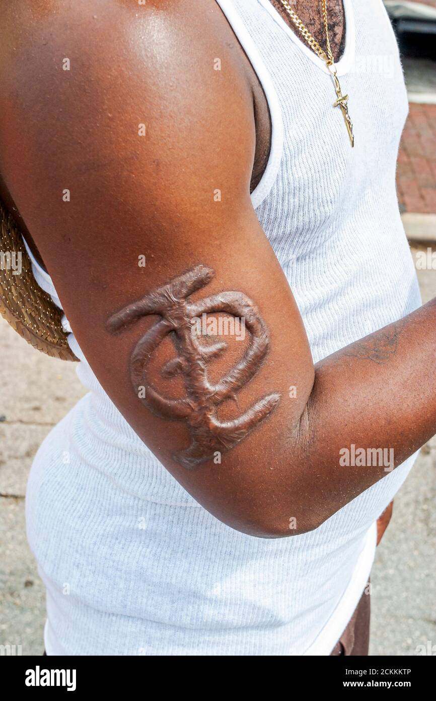 Arm branded with fraternity symbol hires stock photography and images