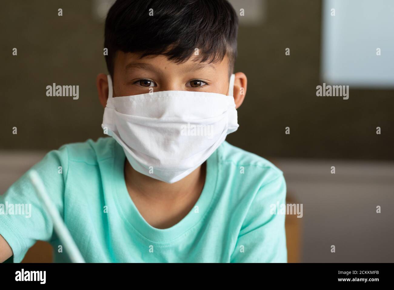 Portrait of boy wearing face mask at school Stock Photo