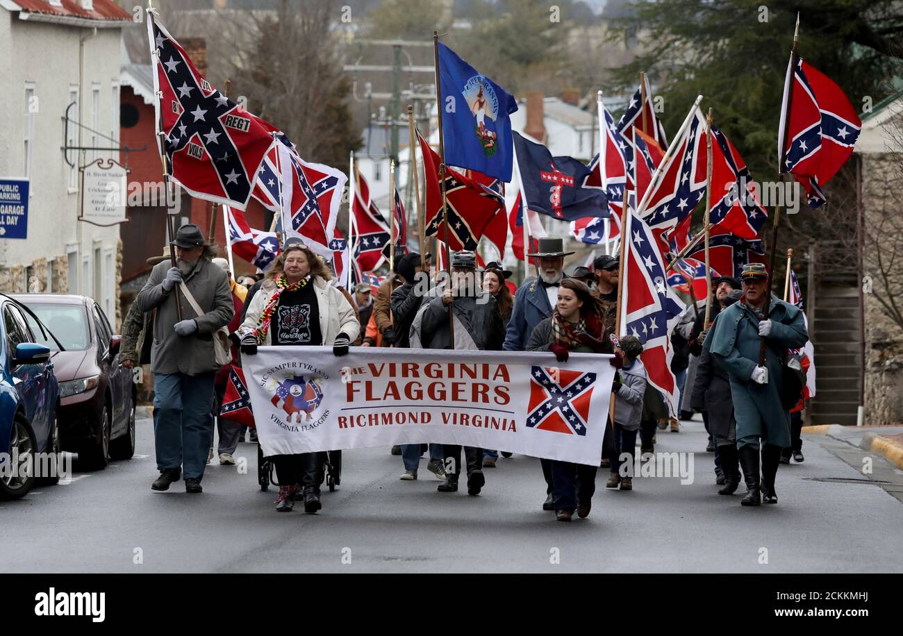 Supporters of the continued display of Confederate generals’ statues and other symbols march with Confederate flags in Lexington, Virginia, U.S. January 18, 2020. REUTERS/Jim Urquhart Stock Photo