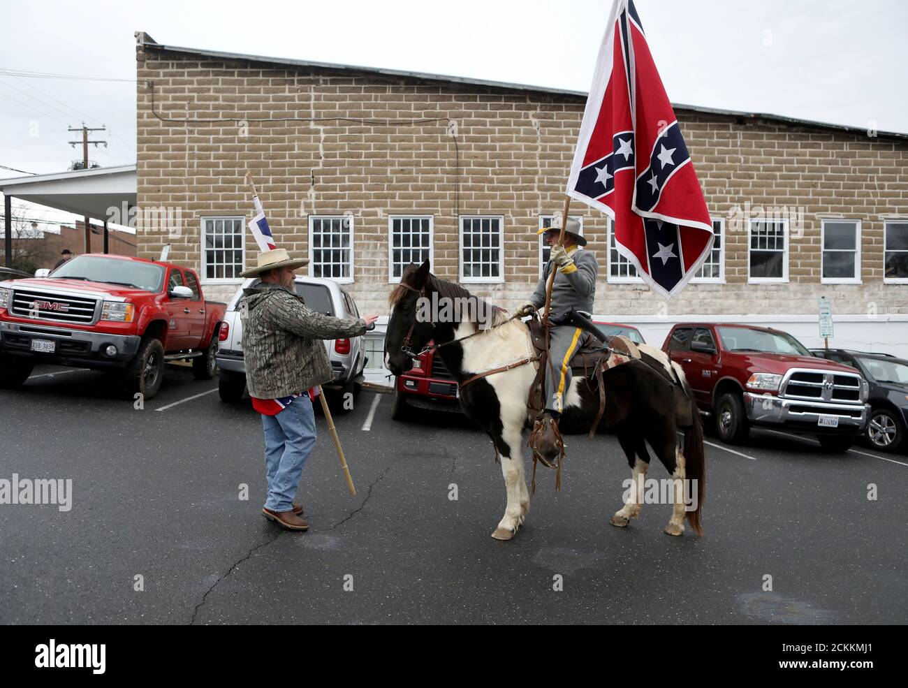 Supporters of the continued display of Confederate generals’ statues and other symbols finish a march holding Confederate flags in Lexington, Virginia, U.S. January 18, 2020. REUTERS/Jim Urquhart Stock Photo