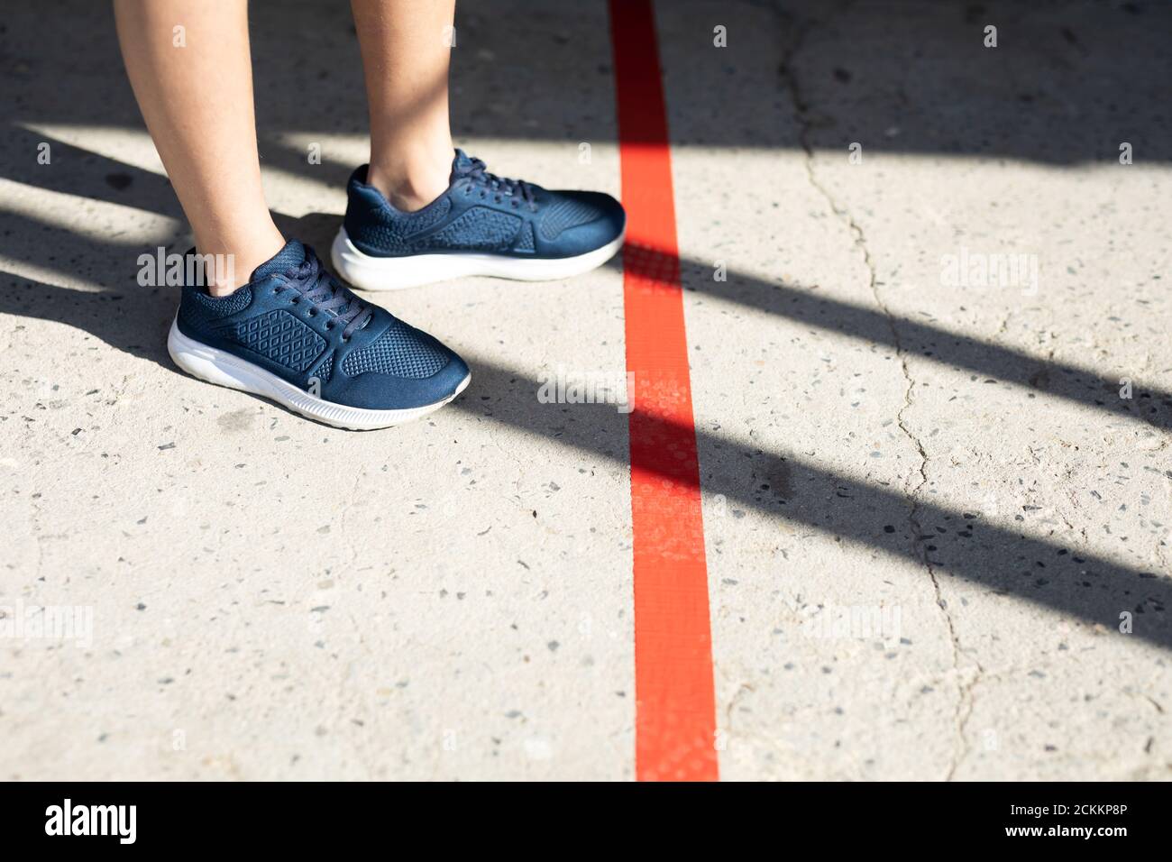 Low section of boy maintaining social distancing at school Stock Photo