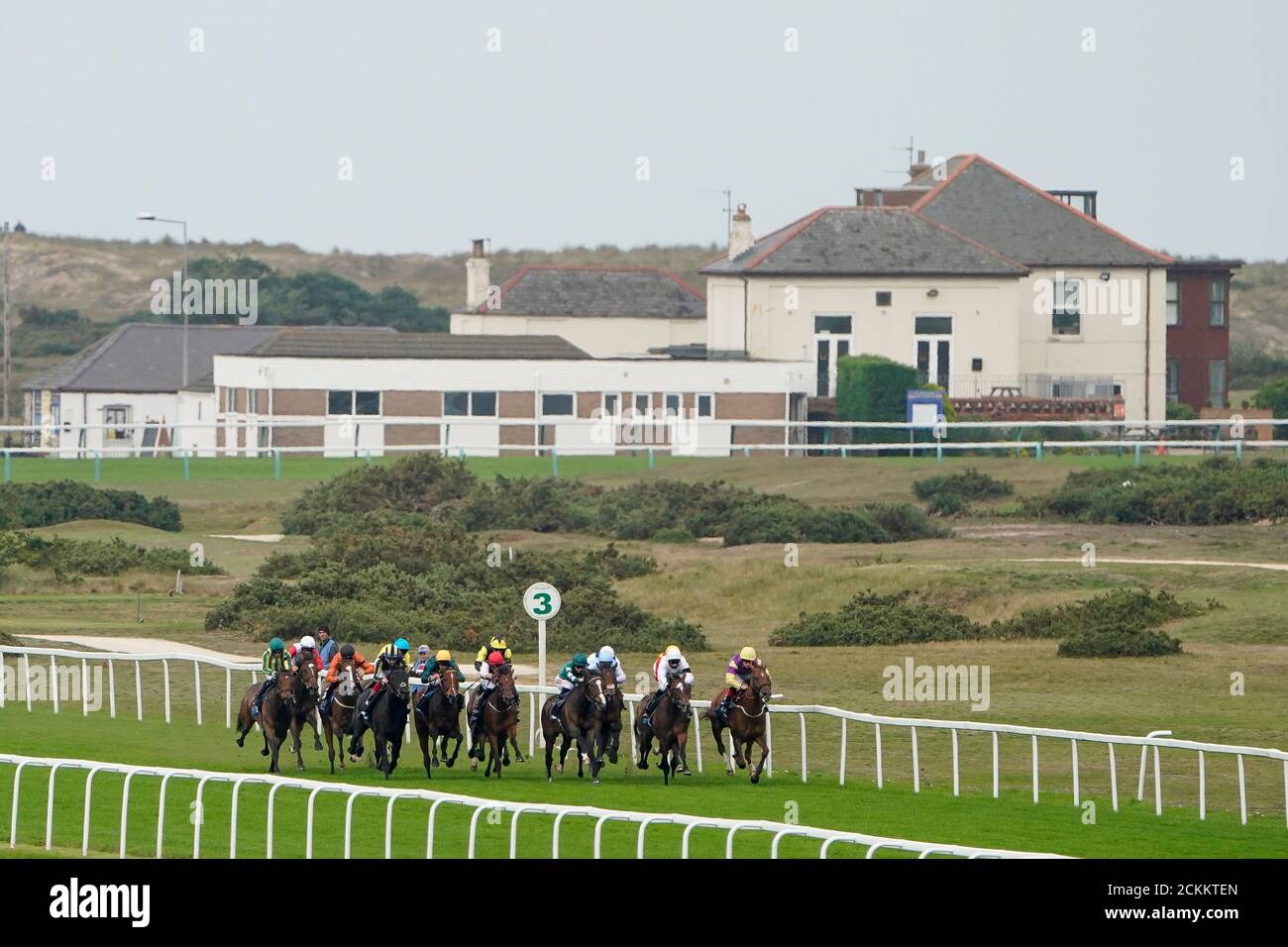 Hollie Doyle riding Majestic Noor (fourth right, green) win The EBF Stallions John Musker Fillies' Stakes at Great Yarmouth Racecourse. Stock Photo