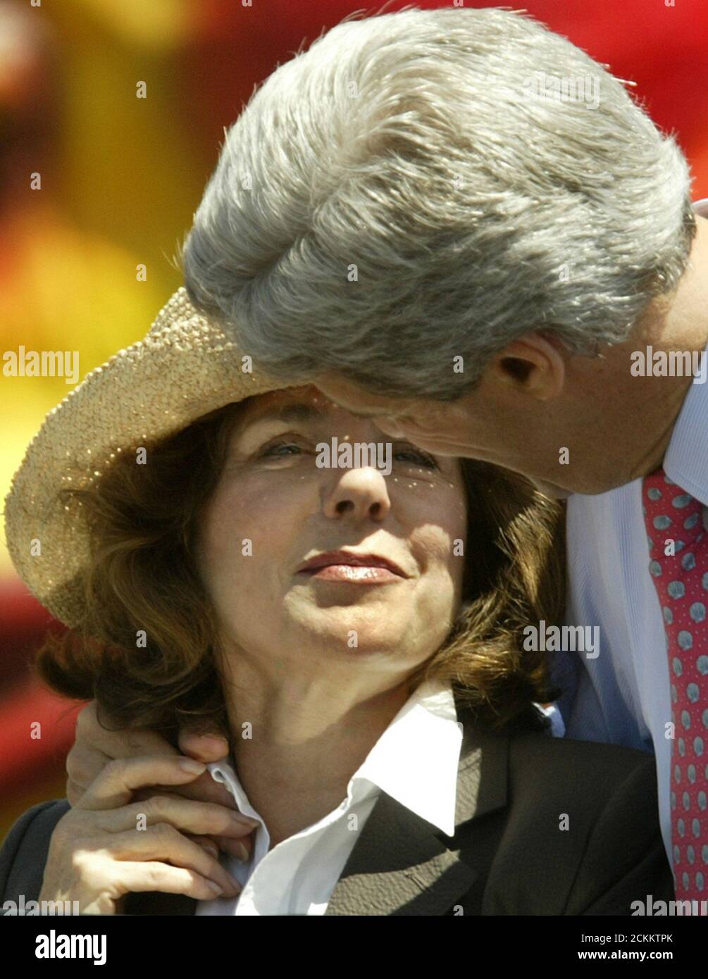 U.S. Democratic Presidential candidate John Kerry (R) hugs his wife Teresa Heinz Kerry after making a speech at Woodrow Wilson High School in Los Angeles, May 5, 2004. Kerry, the presumptive Democratic presidential nominee, has vowed to take a tougher line than U.S. President George W. Bush against foreign exchange manipulation. Last week, he pledged 'a no-nonsense effort to stop illegal currency manipulation that's going in countries like China and Japan.' REUTERS/Lucy Nicholson US ELECTION  LN/GN Stock Photo