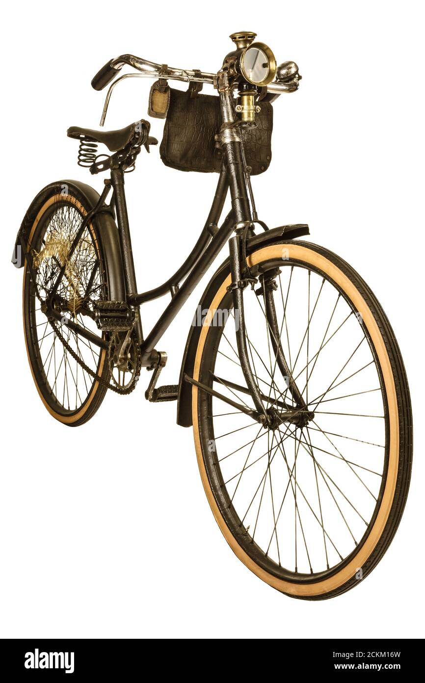 Retro styled image of a nineteenth century bike with lantern isolated on a white background Stock Photo
