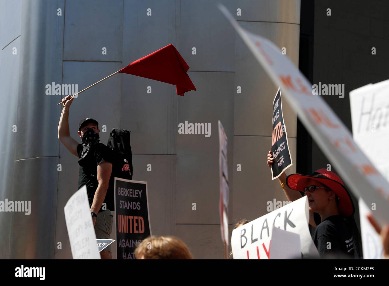 A demonstrator waves a flag during the Bay Area Rally Against Hate counter-protest against the cancelled No Marxism in America rally in Berkeley, California, U.S. August 27, 2017. REUTERS/Stephen Lam Stock Photo