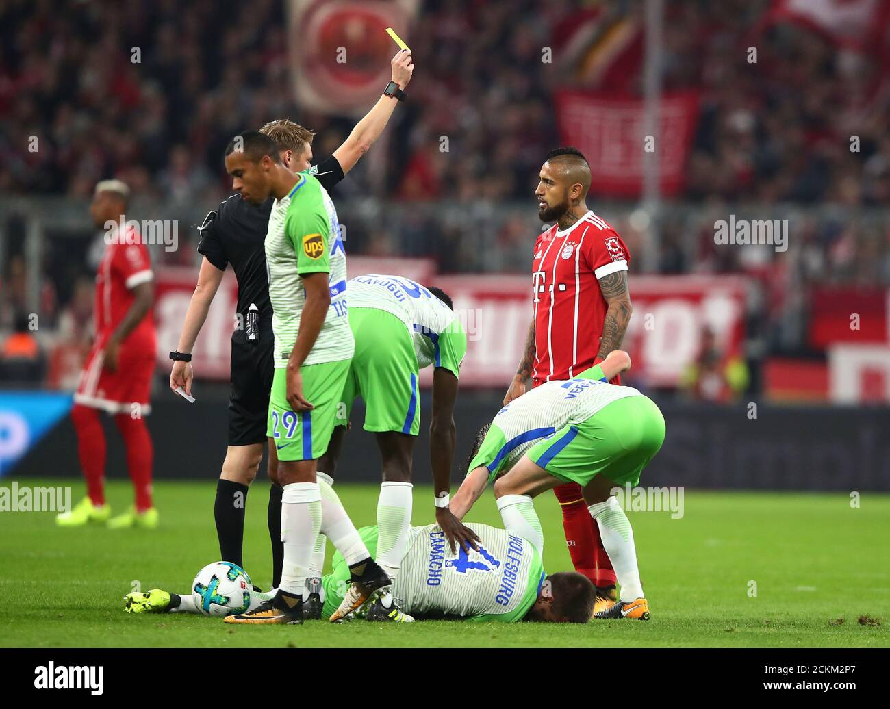 Soccer Football Bundesliga Fc Bayern Munich Vs Vfl Wolfsburg Allianz Arena Munich Germany September 22 2017 Bayern Munich S Arturo Vidal Is Shown A Yellow Card By Referee Christian