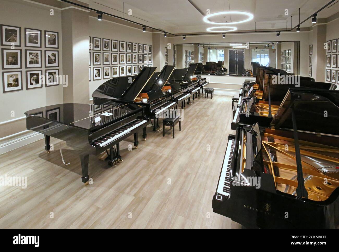 Steinway grand pianos on display at a central London showroom. The models shown cost between £50,000 and £150,000 Stock Photo