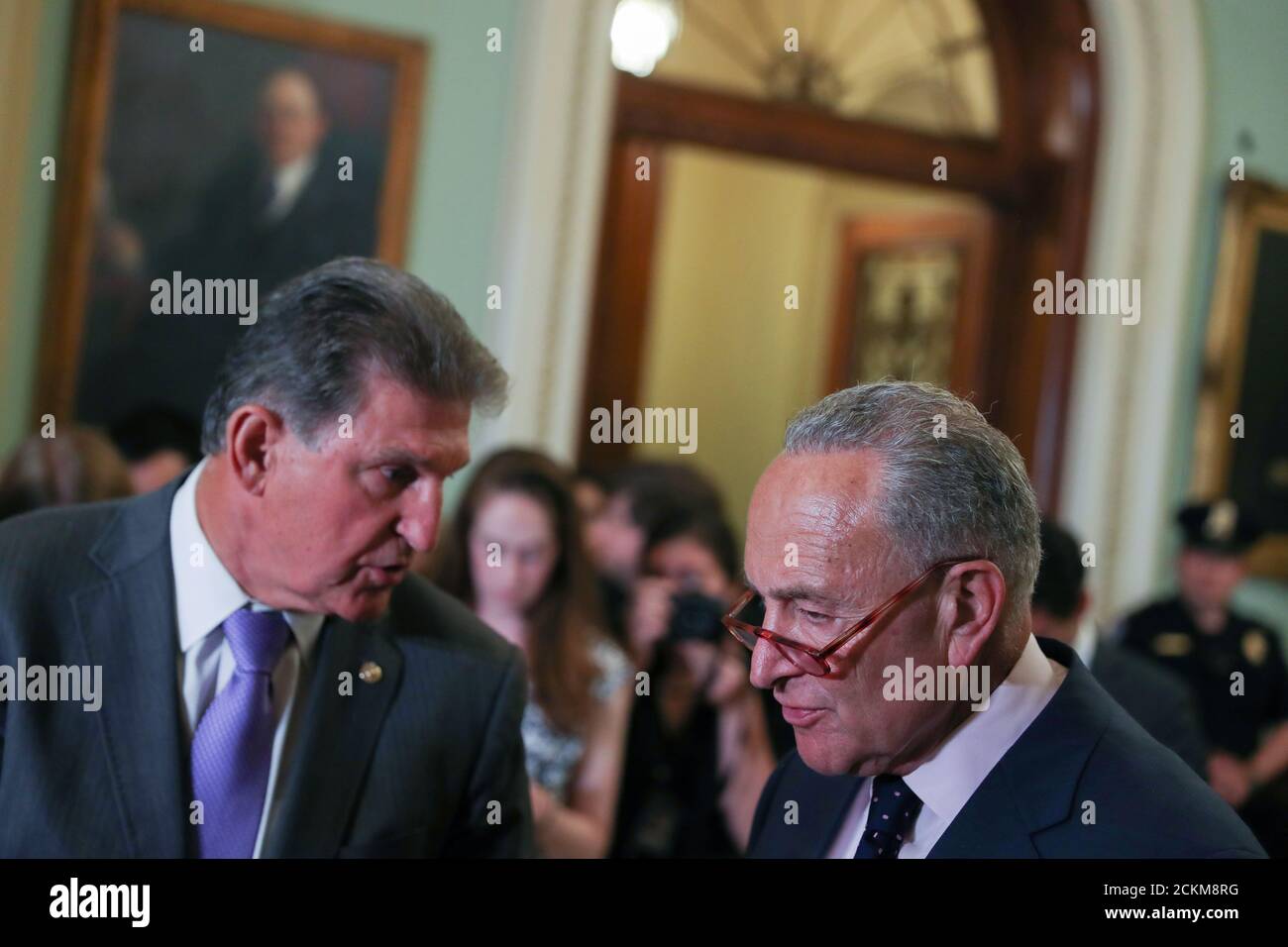 U.S. Senate Minority Leader Chuck Schumer (D-NY) and Senator Joe Manchin (D-WV) confer before addressing reporters following the weekly senate party caucus luncheons at the U.S. Capitol in Washington, U.S. July 9, 2019. REUTERS/Jonathan Ernst Stock Photo