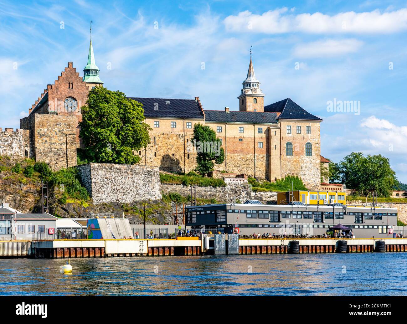 Akershus Castle fortress and former royal residence seen from the waterfront in Oslofjord in Oslo Norway Stock Photo