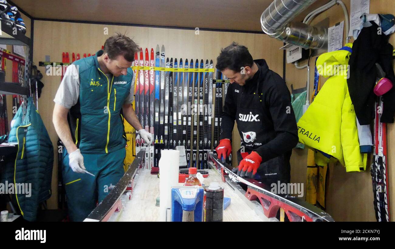 Wax technicians Gus Kaeding and Randy Gibbs of the Australian cross-country ski team work on sets of skis during the Pyeongchang 2018 Winter Olympics, in Pyeongchang, South Korea, February 20, 2018. Picture taken February 20, 2018. REUTERS/Philip O'Connor Stock Photo
