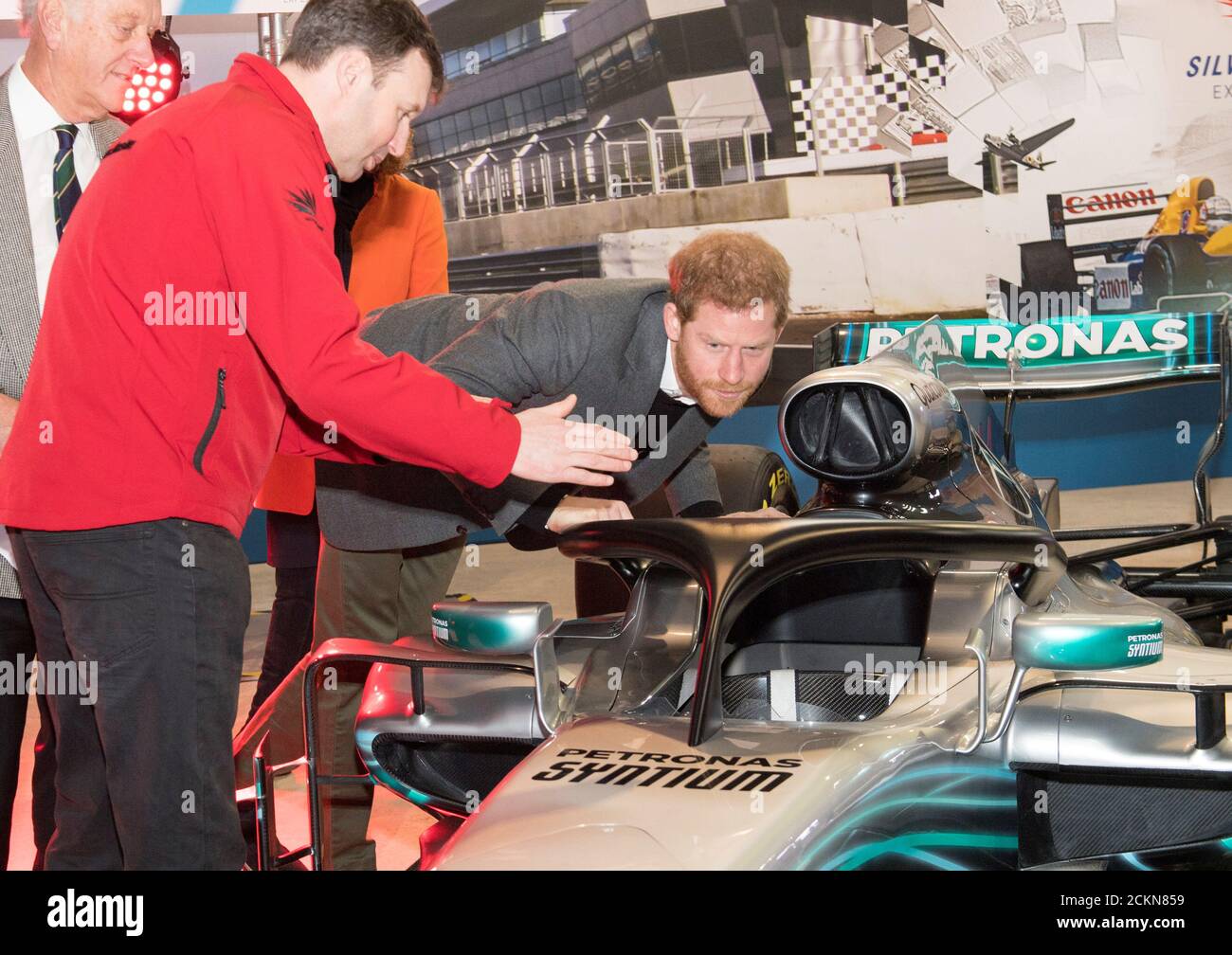 Britain's Prince Harry studies 'The Halo' on Lewis Hamiltons Mercedes during a visit to the Silverstone University Technical College at Silverstone, Britain, March 7, 2018. REUTERS/Arthur Edwards/Pool Stock Photo