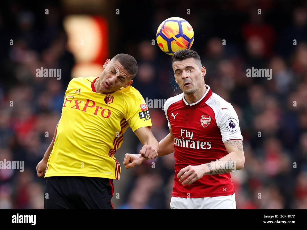 Soccer Football - Premier League - Arsenal vs Watford - Emirates Stadium, London, Britain - March 11, 2018   Watford's Richarlison in action with Arsenal's Granit Xhaka              REUTERS/Eddie Keogh    EDITORIAL USE ONLY. No use with unauthorized audio, video, data, fixture lists, club/league logos or "live" services. Online in-match use limited to 75 images, no video emulation. No use in betting, games or single club/league/player publications.  Please contact your account representative for further details. Stock Photo