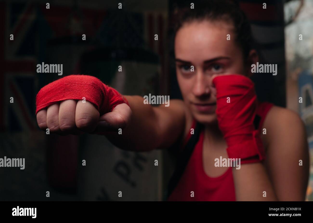Boxer girl in red boxing bands closeup Stock Photo Alamy