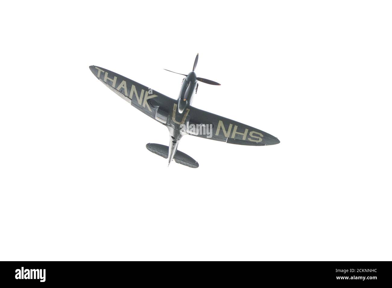 Cumbernauld, Scotland, UK. 16th Sep, 2020. Pictured: Special flight of a spitfire plane which has the message “THANK U NHS” painted onto the underside of the fuselage is seen doing aerobatics in front of a crowd which has gathered outside Cumbernauld Airport, before it is seen landing for the evening. Tomorrow the spitfire will go on around Scotland tour flying over various hospitals thanking the NHS for its hard work during the coronavirus (COVID-19) pandemic. Credit: Colin Fisher/Alamy Live News Stock Photo