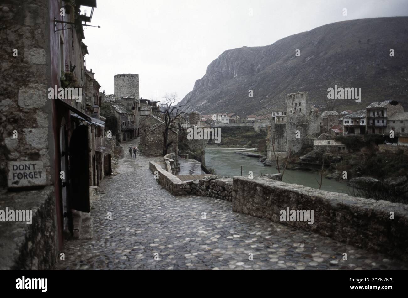 6th December 1995 During the war in Bosnia: the view along Kujundžiluk street towards the Stari Most (Old Bridge), and the Neretva River in Mostar. Stock Photo