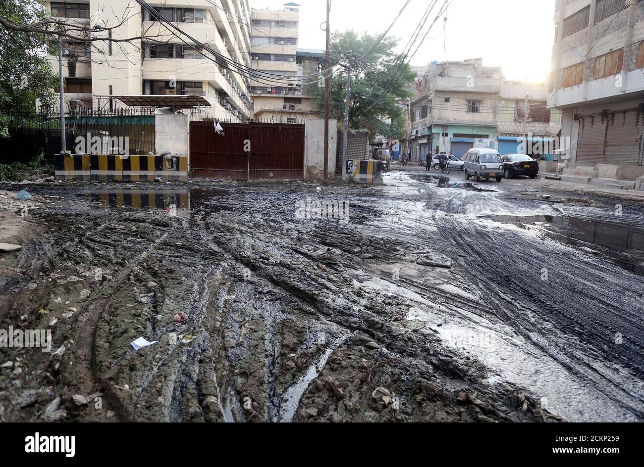 Hectic street full of garbage rainwater and sewerage water after heavy downpour of monsoon season, causing unhygienic atmosphere and creating problems for commuters, showing negligence of concerned authorities, at Sindh Secretariat in Karachi on Wednesday, September 16, 2020. Stock Photo
