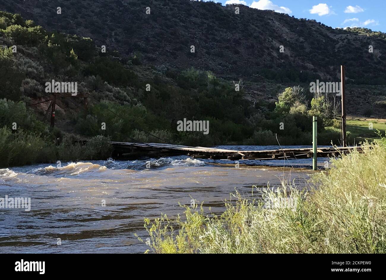 High water on the Rio Grande river close to flowing over local bridge  nicknamed Òdecapitation bridge.