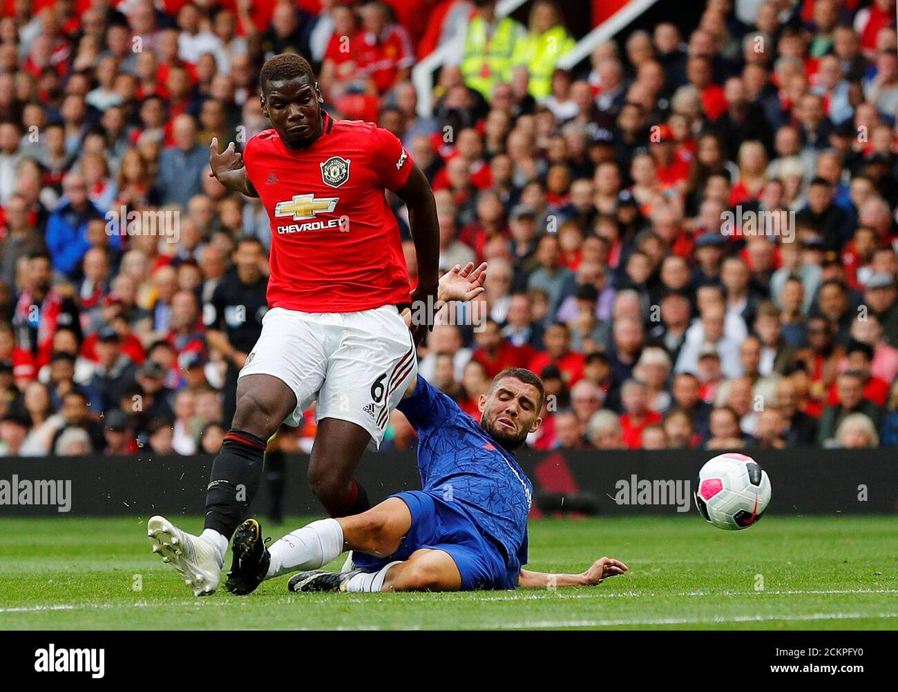 Soccer Football - Premier League - Manchester United v Chelsea - Old Trafford, Manchester, Britain - August 11, 2019  Manchester United's Paul Pogba in action with Chelsea's Mateo Kovacic   REUTERS/Phil Noble  EDITORIAL USE ONLY. No use with unauthorized audio, video, data, fixture lists, club/league logos or 'live' services. Online in-match use limited to 75 images, no video emulation. No use in betting, games or single club/league/player publications.  Please contact your account representative for further details. Stock Photo