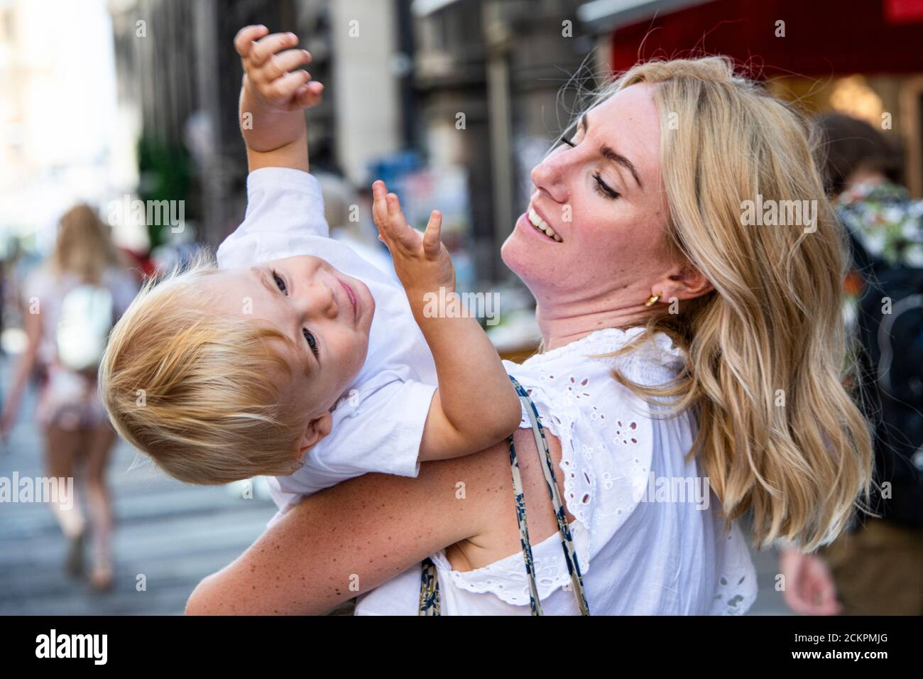 Young pretty boy playing with his mother and having fun Stock Photo