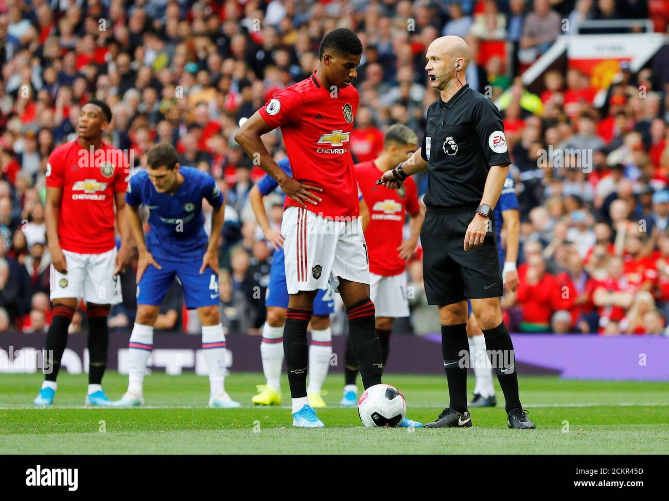Soccer Football - Premier League - Manchester United v Chelsea - Old Trafford, Manchester, Britain - August 11, 2019  Manchester United's Marcus Rashford receives instructions from referee Anthony Taylor before taking a penalty  REUTERS/Phil Noble  EDITORIAL USE ONLY. No use with unauthorized audio, video, data, fixture lists, club/league logos or 'live' services. Online in-match use limited to 75 images, no video emulation. No use in betting, games or single club/league/player publications.  Please contact your account representative for further details. Stock Photo