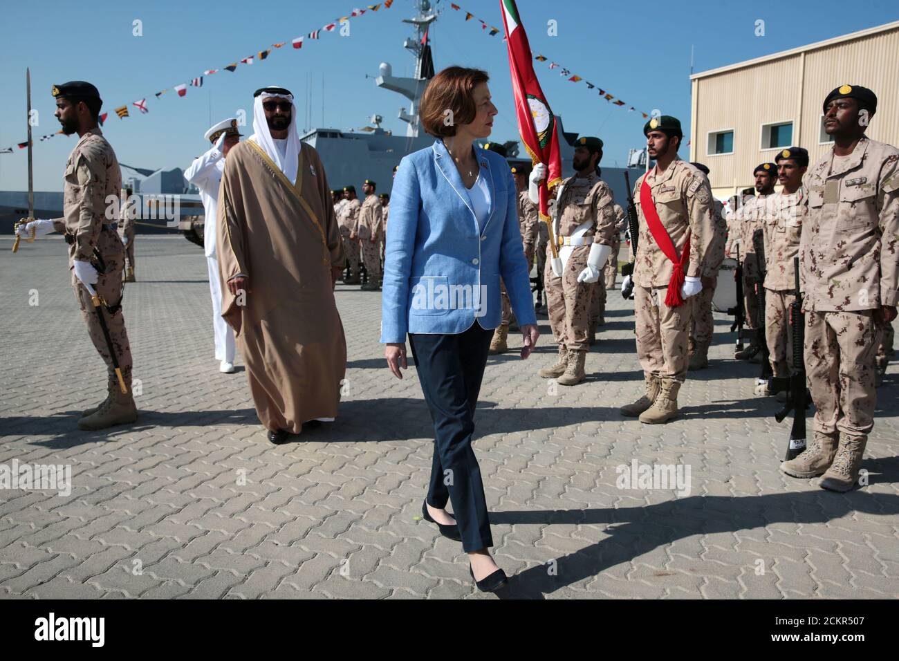 French Defence Minister Florence Parly and United Arab Emirates' Minister  of State for Defence Mohammed Bin Ahmad al-Bawardi inspect members of an  honour guard during a military ceremony at the French Naval