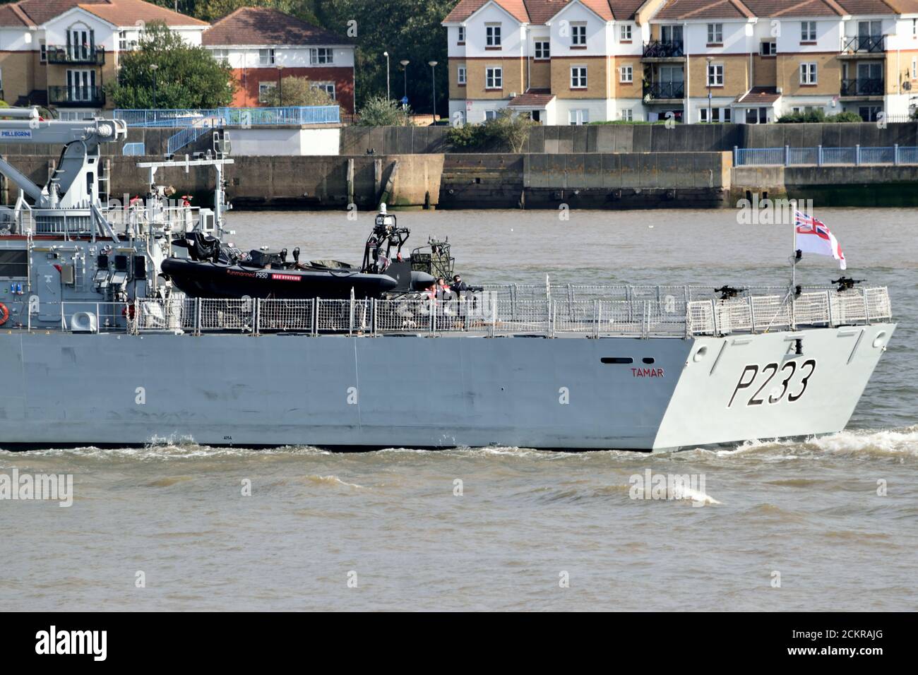 HMS Tamar, a Batch 2 River-class offshore patrol vessel of the Royal Navy, heads down the River Thames after paying its first visit to London Stock Photo