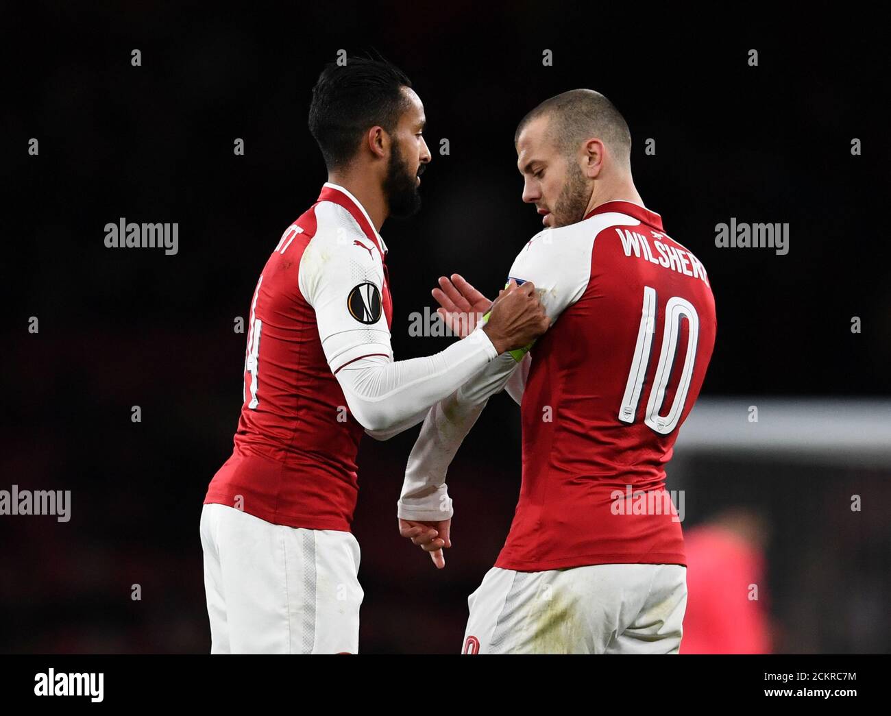 Soccer Football - Europa League - Arsenal vs BATE Borisov - Emirates Stadium, London, Britain - December 7, 2017   Arsenal's Theo Walcott gives the captains armband to Jack Wilshere before being substituted    REUTERS/Dylan Martinez Stock Photo