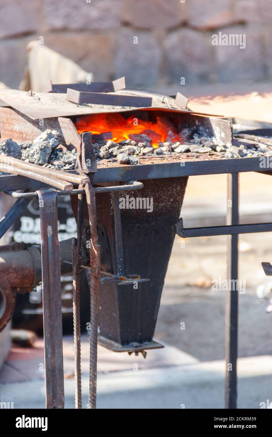Hot coals in a forge brazier Stock Photo