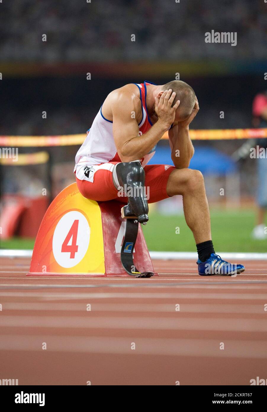 Beijing, China  September 11, 2008: Day 5 of competition at the Beijing 2008 Paralympic Games showing pentathlete Urs Kolly of Switzerland concentrating before the start of the men's P44 400-meters where he finished second.   ©Bob Daemmrich Stock Photo