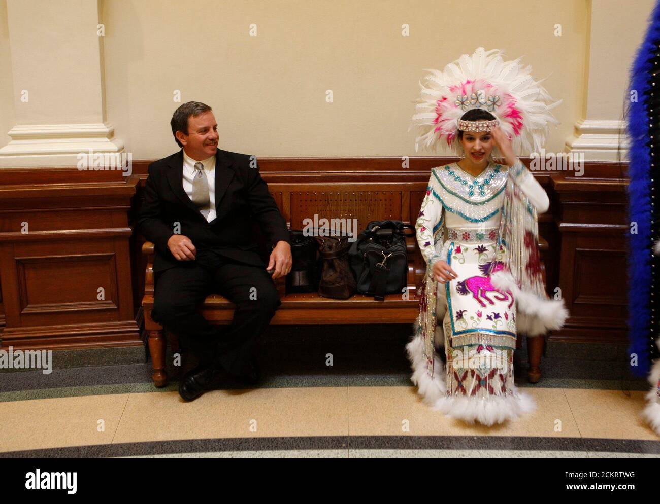 Austin, TX January 25, 2009: Teen girl dressed in Princess Pocahontas costume sits on the floor of the Texas House of Representatives to promote the 112th- annual George Washington's Birthday celebration in the border towns of Laredo and Nuevo Laredo, Mexico. ©Bob Daemmrich Stock Photo