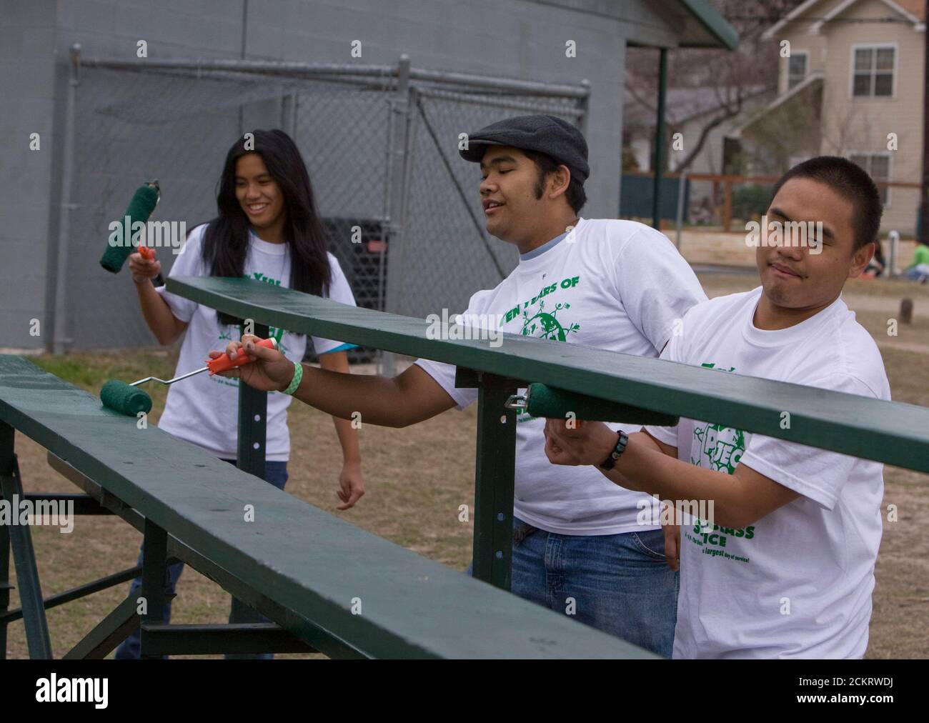 Austin, TX February 14, 2009: University of Texas at Austin students, including members of the Filipino-American Students Assn., work on sprucing up houses and public areas in east Austin as part of the second annual Clinton Global Initiative University, a conference bringing together students to take action on global challenges such as poverty, hunger, energy, climate change and global health. The program is patterned after Clinton Global Initiative Foundation formed by President Bill Clinton. ©Bob Daemmrich Stock Photo