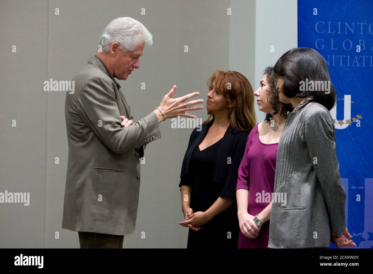 Austin, TX February 14, 2009: Former President Bill Clinton (l) speaks with attendees as he hosts the second annual Clinton Global Initiative University, a conference bringing together more than 1,000 students to take action on global challenges such as poverty, hunger, energy, climate change and global health. ©Bob Daemmrich Stock Photo