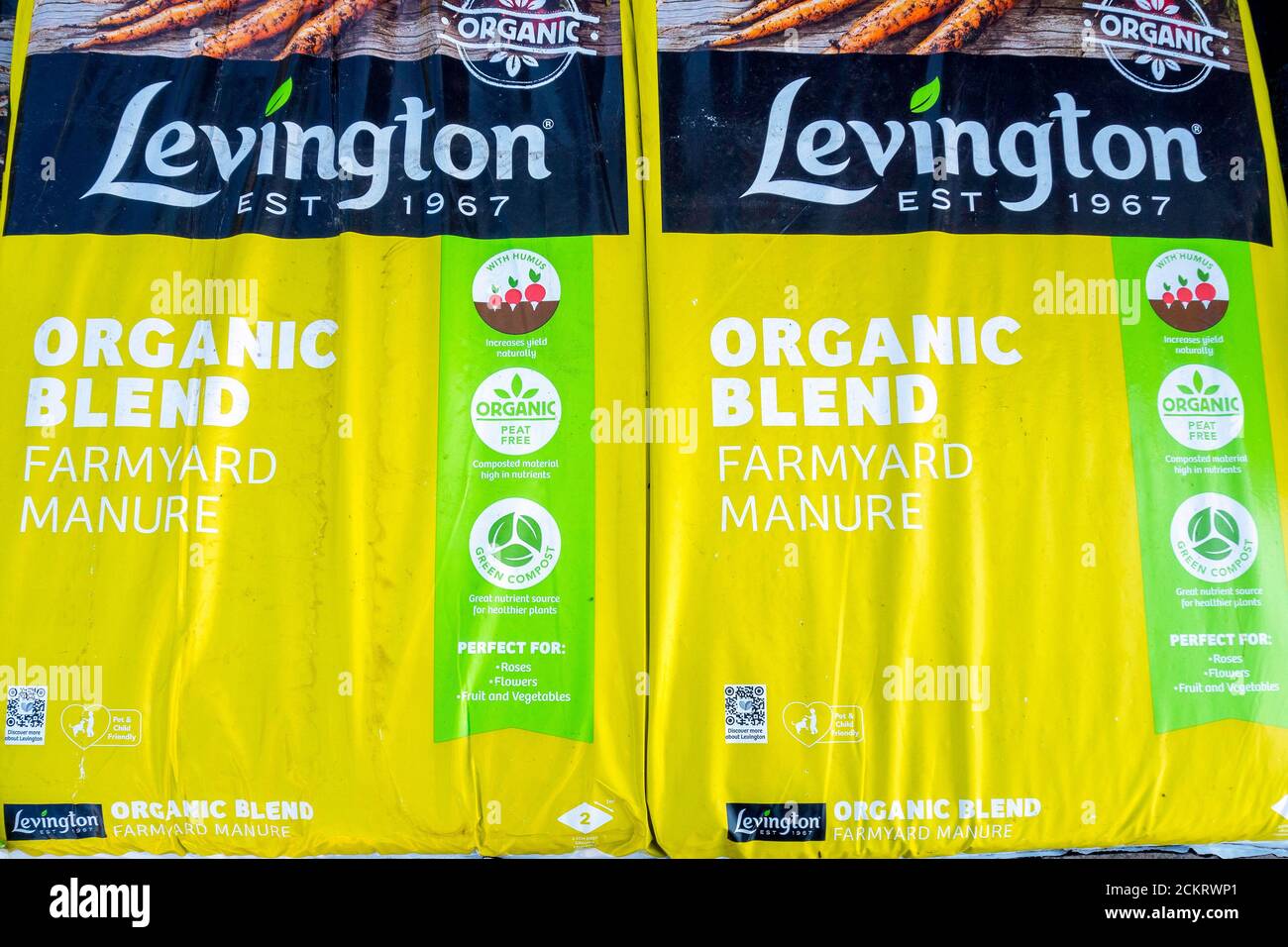 A stack of bags of Organic Farmyard Manure improving soil quality and