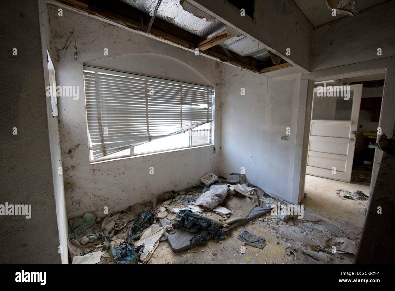 Laredo, TX  February 19, 2009: Interior of an abandoned house along the Rio Grande River used for illegal immigrants to hide in while awaiting transportation in the United States. This house is in a neighborhood in west Laredo. ©Bob Daemmrich Stock Photo