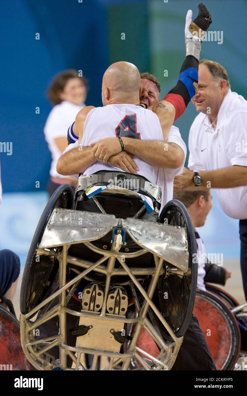 Beijing, China  September 14, 2008: Day ten of athletic competition at the 2008 Paralympic Games showing the United States' coach Bob Murray hugging player Bryan Kirkland (4) after the US won the gold medal in men's wheelchair rugby. ©Bob Daemmrich Stock Photo