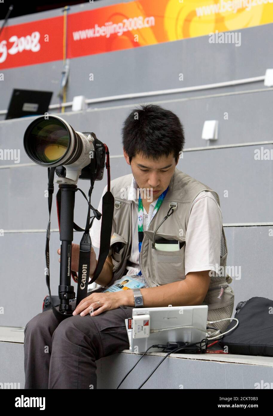Beijing, China  September 6, 2008: Japanese photographer who works for Asahi Shimbun at the Opening Ceremonies of the Beijing Paralympics at China's National Stadium, known as the Bird's Nest.  ©Bob Daemmrich Stock Photo