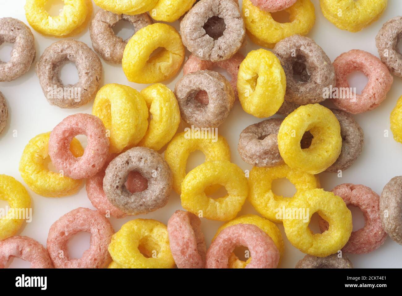 Background of colorful cereal rings on white background Stock Photo