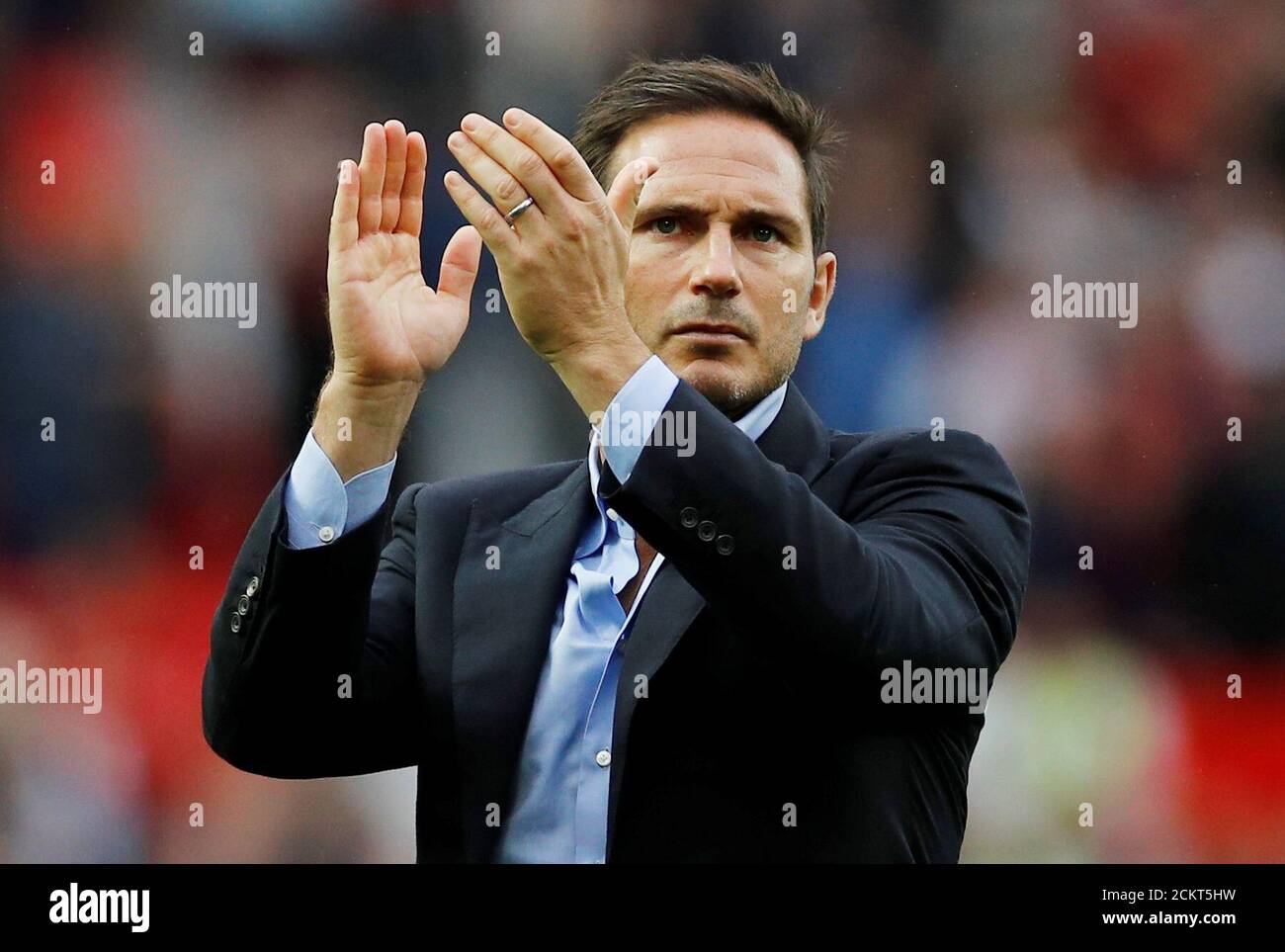Soccer Football - Premier League - Manchester United v Chelsea - Old Trafford, Manchester, Britain - August 11, 2019  Chelsea manager Frank Lampard applauds fans at the end of the match  REUTERS/Phil Noble  EDITORIAL USE ONLY. No use with unauthorized audio, video, data, fixture lists, club/league logos or 'live' services. Online in-match use limited to 75 images, no video emulation. No use in betting, games or single club/league/player publications.  Please contact your account representative for further details. Stock Photo
