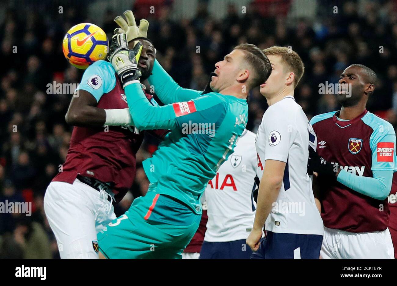 Soccer Football - Premier League - Tottenham Hotspur vs West Ham United - Wembley Stadium, London, Britain - January 4, 2018   West Ham United's Adrian collides with Cheikhou Kouyate as he attempts to gather the ball   REUTERS/Eddie Keogh    EDITORIAL USE ONLY. No use with unauthorized audio, video, data, fixture lists, club/league logos or 'live' services. Online in-match use limited to 75 images, no video emulation. No use in betting, games or single club/league/player publications.  Please contact your account representative for further details. Stock Photo