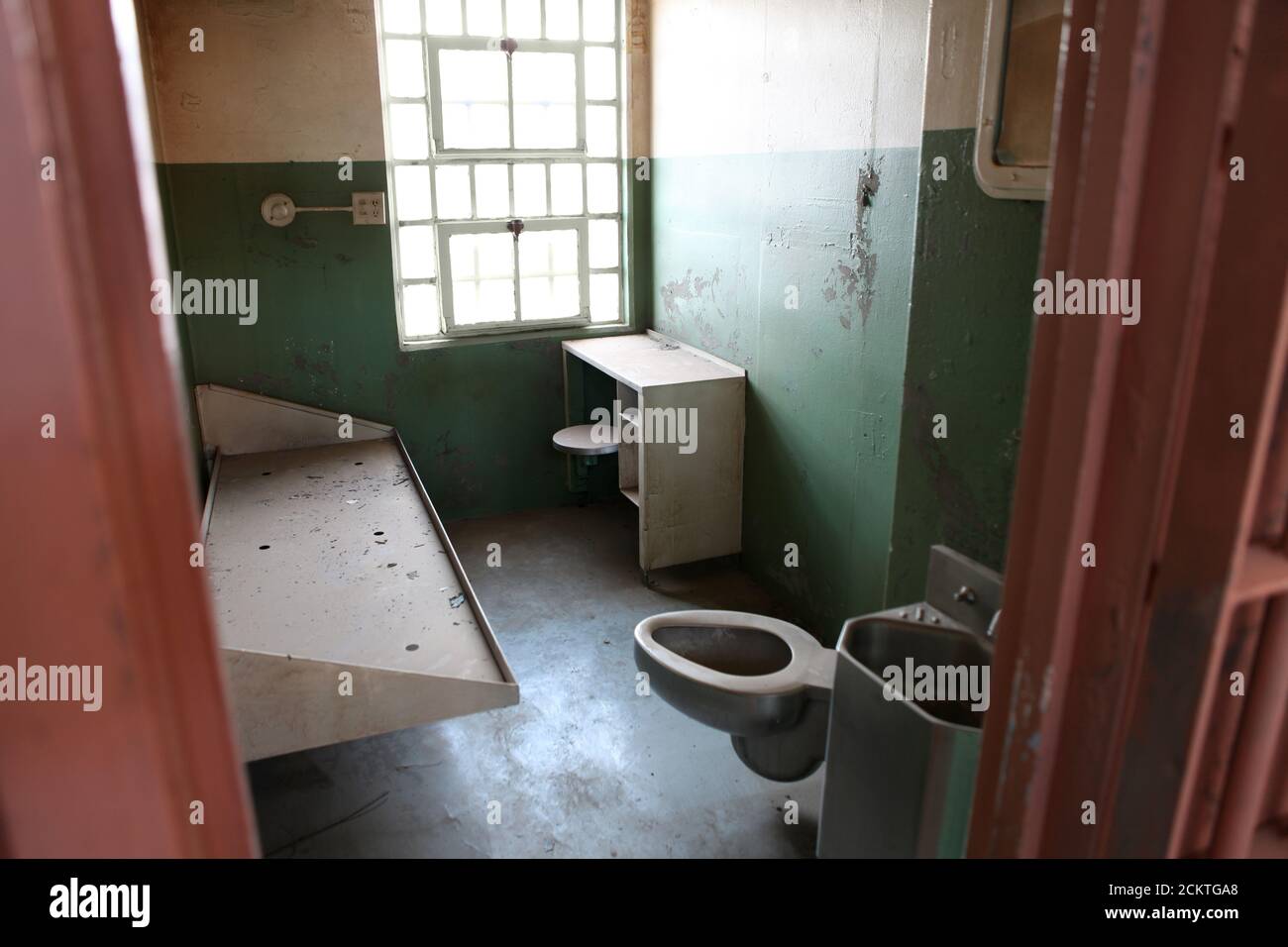 Rundown jail cell in an unused government owned facility. Stock Photo