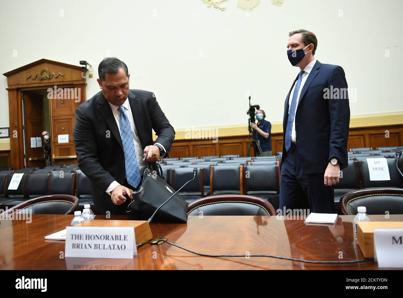 Washington, United States. 16th Sep, 2020. Brian Bulatao (L), Under Secretary of State for Management, and Marik String, Acting Legal Adviser for the State Department, pack up after testifying before a House Committee on Foreign Affairs hearing looking into the firing of State Department Inspector General Steven Linick, on Capitol Hill in Washington, DC on Wednesday, September 16, 2020. Photo by Kevin Dietsch/UPI Credit: UPI/Alamy Live News Stock Photo