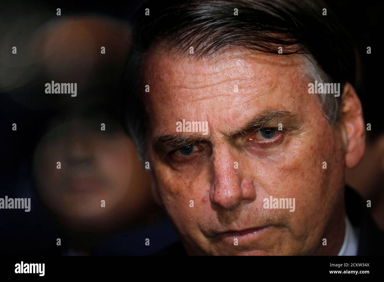 Brazil's President Jair Bolsonaro speaks during a ceremony for signature of the decree of the new regulation on the use, sale and carrying of weapons and ammunition, at Planalto Palace in Brasilia, Brazil May 7, 2019. REUTERS/Adriano Machado Stock Photo