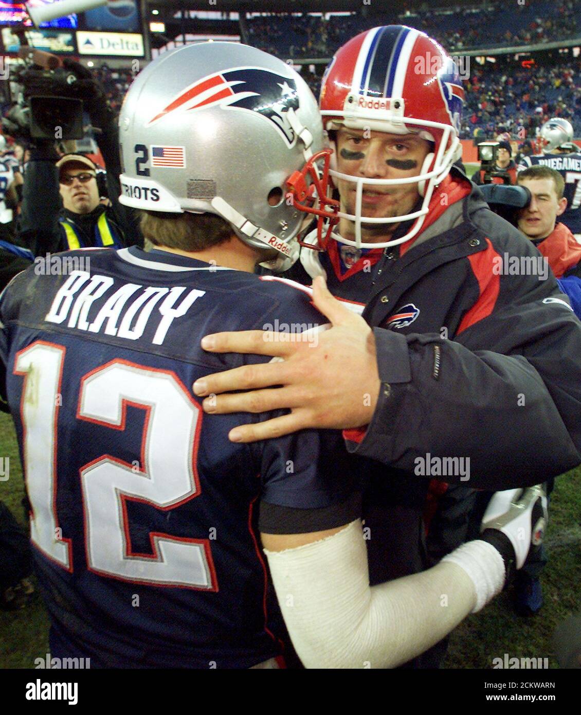 Buffalo Bills' quarterback Drew Bledsoe (R) congratulates New England  Patriots' quarterback Tom Brady (L) after the Patriots defeated the Bills  27-17 in their December 8, 2002 NFL game in Foxboro, Massachusetts. Bledsoe